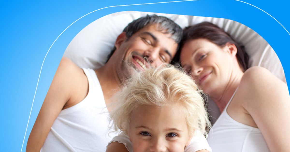 Happy,Little,Girl,On,Bed,With,Thumbs,Up,Smiling,At